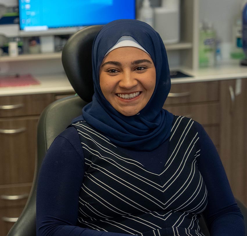 A female patient in a hijab at the Dental Center of Jacksonville, FL