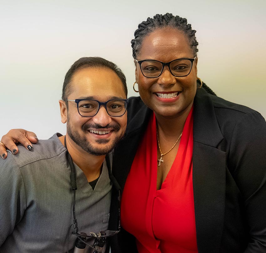 Dr. Antal Barbela poses with a female patient at the Dental Center of Jacksonville
