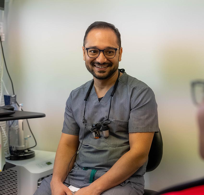 Dr. Antal Barbela in scrub inside the Dental Center of Jacksonville
