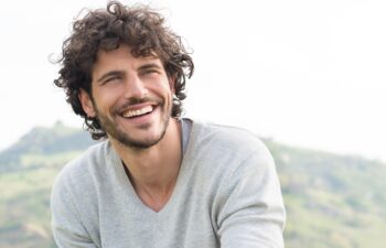Portrait Of Young Handsome Man Smiling Outdoor